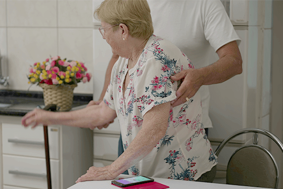 Caregiver helping woman